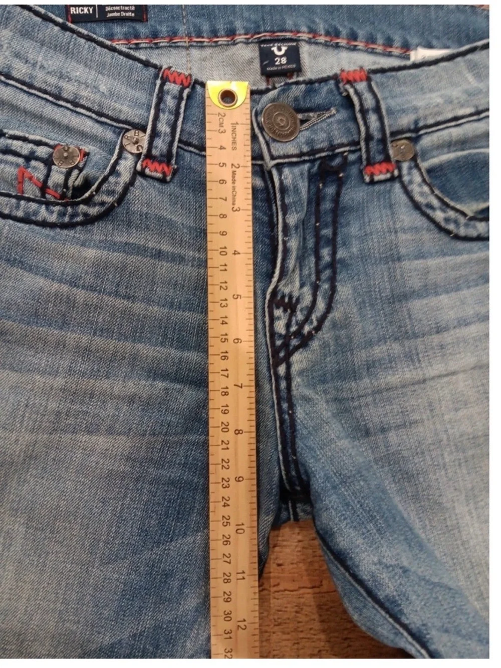 True Religion light blue jeans with red contrast stitching